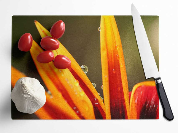 Water droplets on a yellow flower Glass Chopping Board