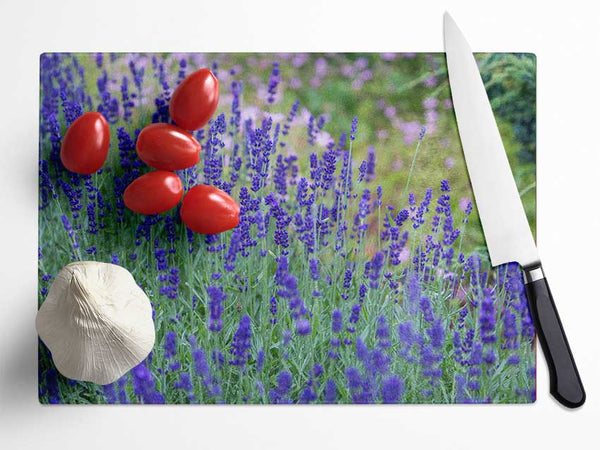 Purple flowers in the meadow spring Glass Chopping Board