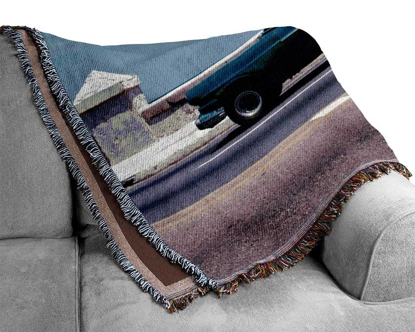 Classic car down the highway Woven Blanket