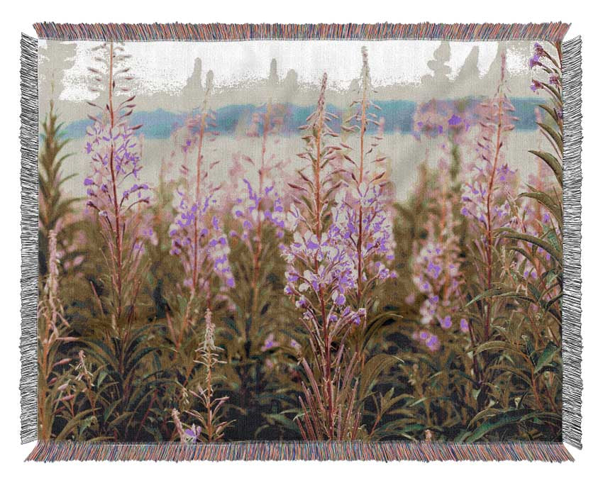 pink flowers in front of the stream Woven Blanket