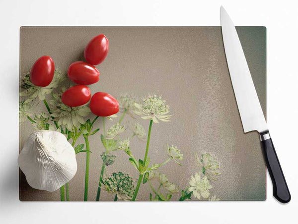 White flowes on the grey Glass Chopping Board