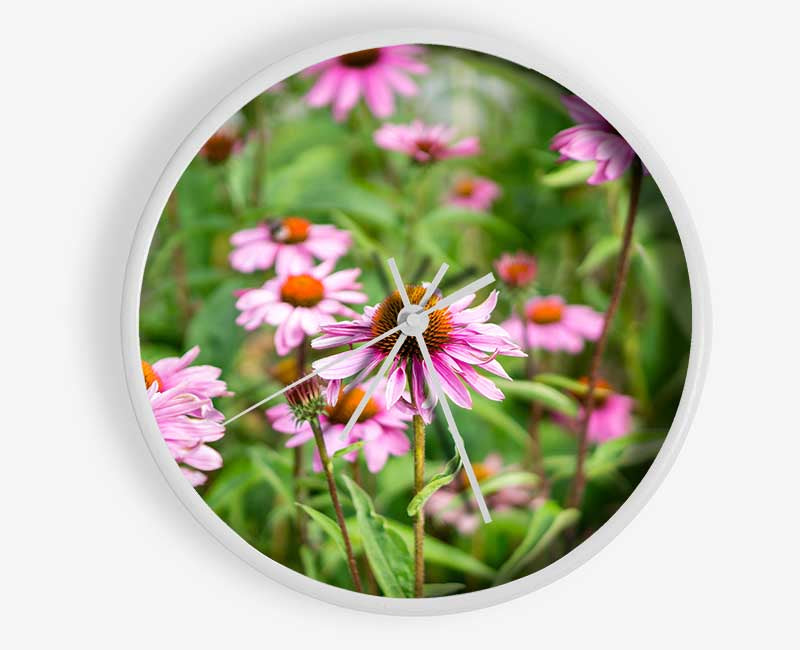 Pink flowers down below in the grass Clock - Wallart-Direct UK