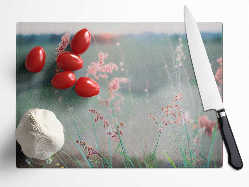 Peach coloured flowers in the morning meadow Glass Chopping Board