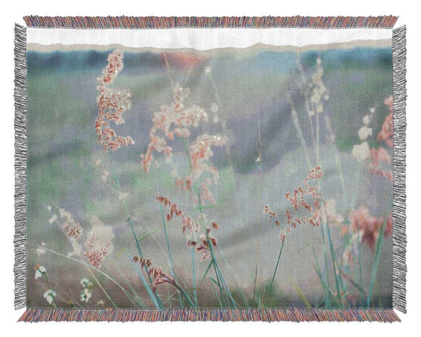 Peach coloured flowers in the morning meadow Woven Blanket