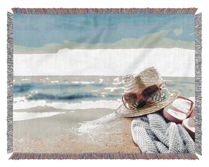 Sun hat and sunglasses on the beach Woven Blanket